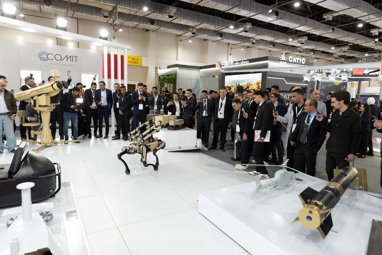 Robotic quadruped demonstration drawing a crowd at a technology exhibition